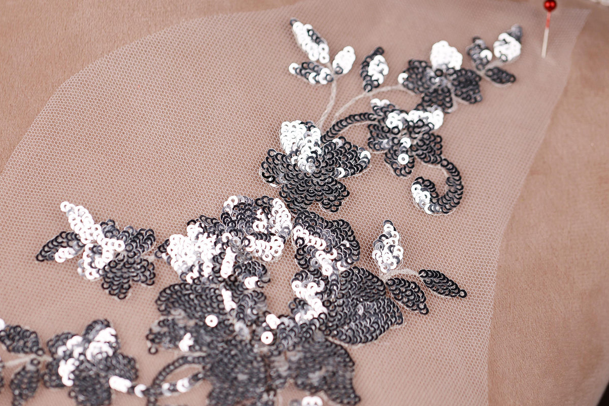 a piece of fabric with sequins on it
