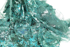 a close-up view of a fabric with a green and silver metallic texture, creating a shimmering and sparkling effect.