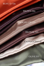 a collection of five different colored silks, each with a label indicating the color and the name of the fabric.