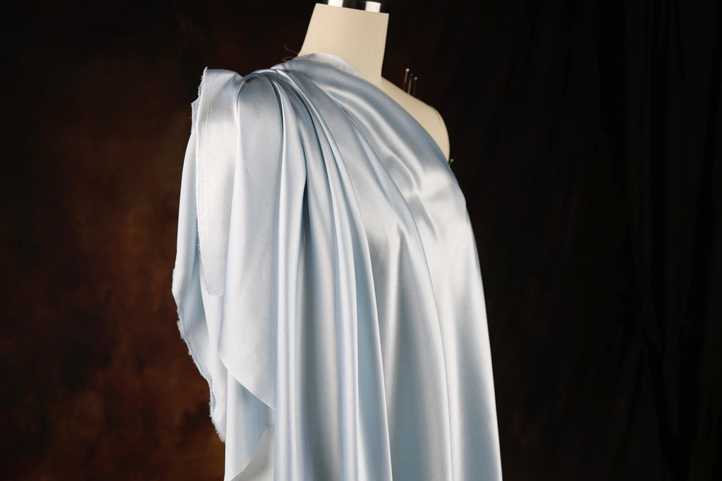 a dress on a mannequin on a black background