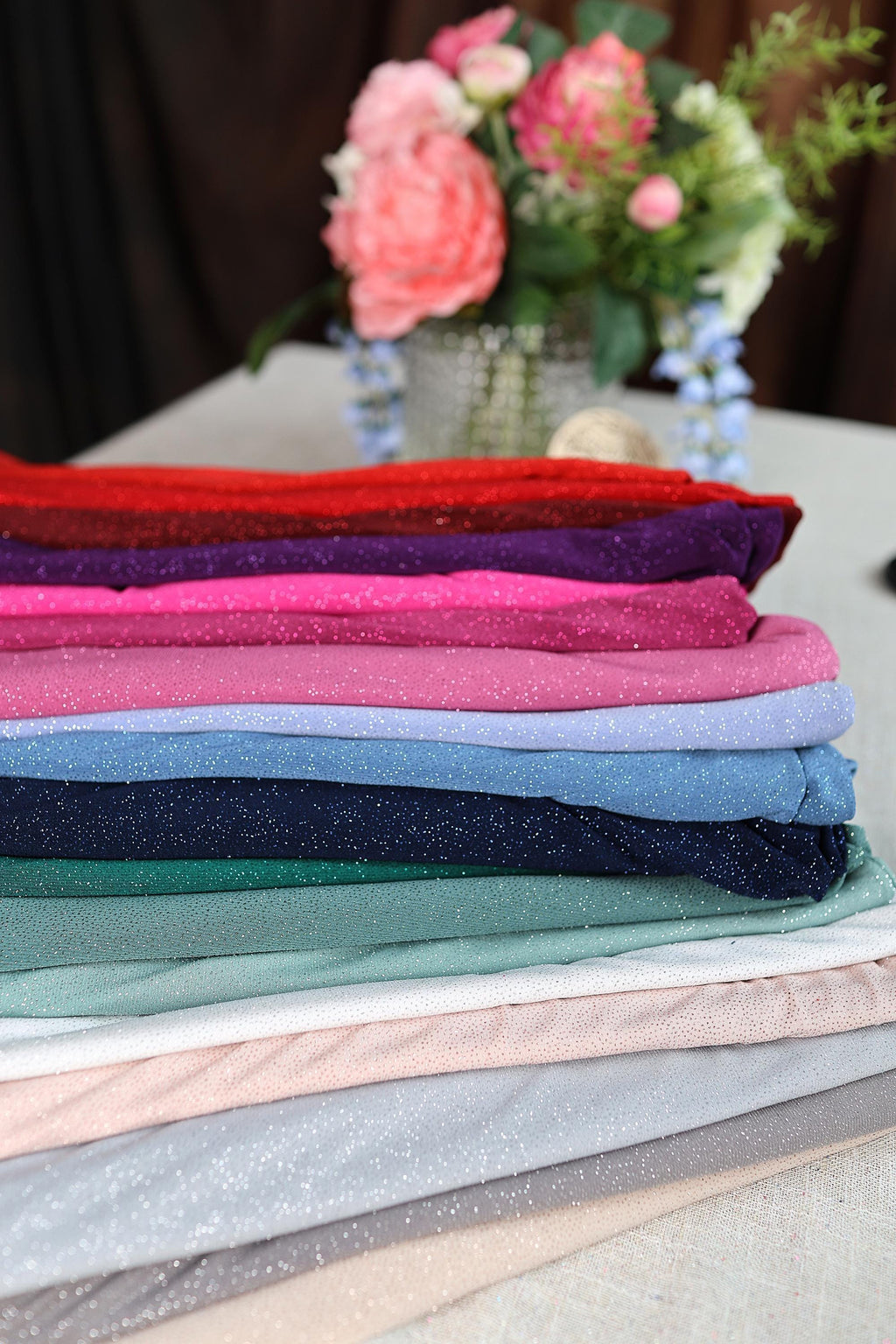 a stack of cloths sitting on top of a table