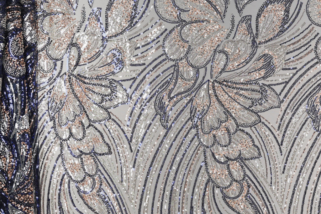a close-up view of a fabric with a floral pattern, showcasing intricate details and textures.