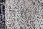 a close-up view of a fabric with a floral pattern, showcasing intricate details and textures.