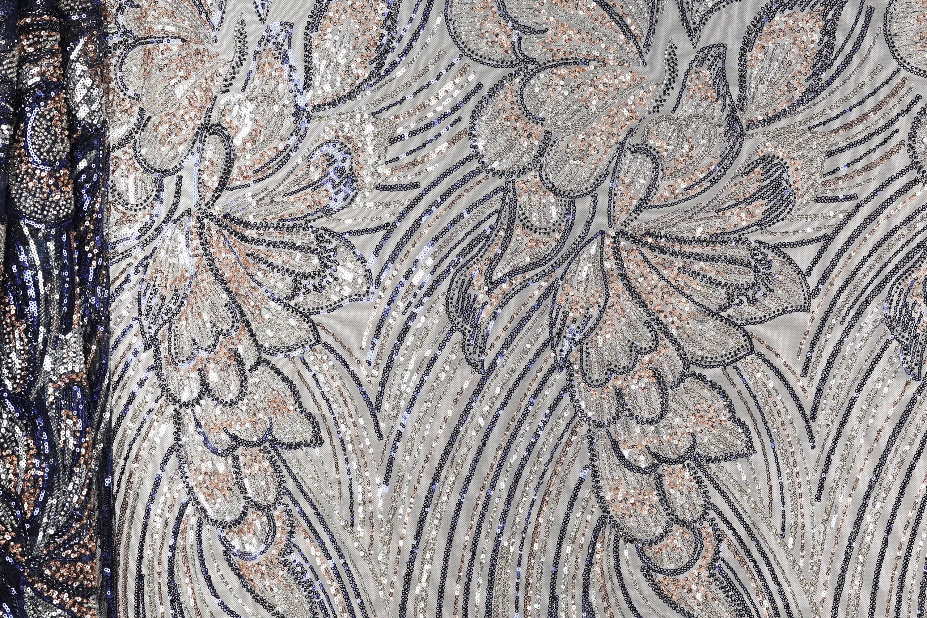 a close-up view of a fabric with a floral pattern, showcasing intricate details and textures.
