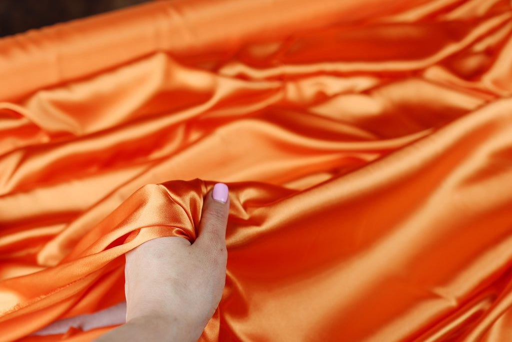 a person holding a piece of cloth in their hand