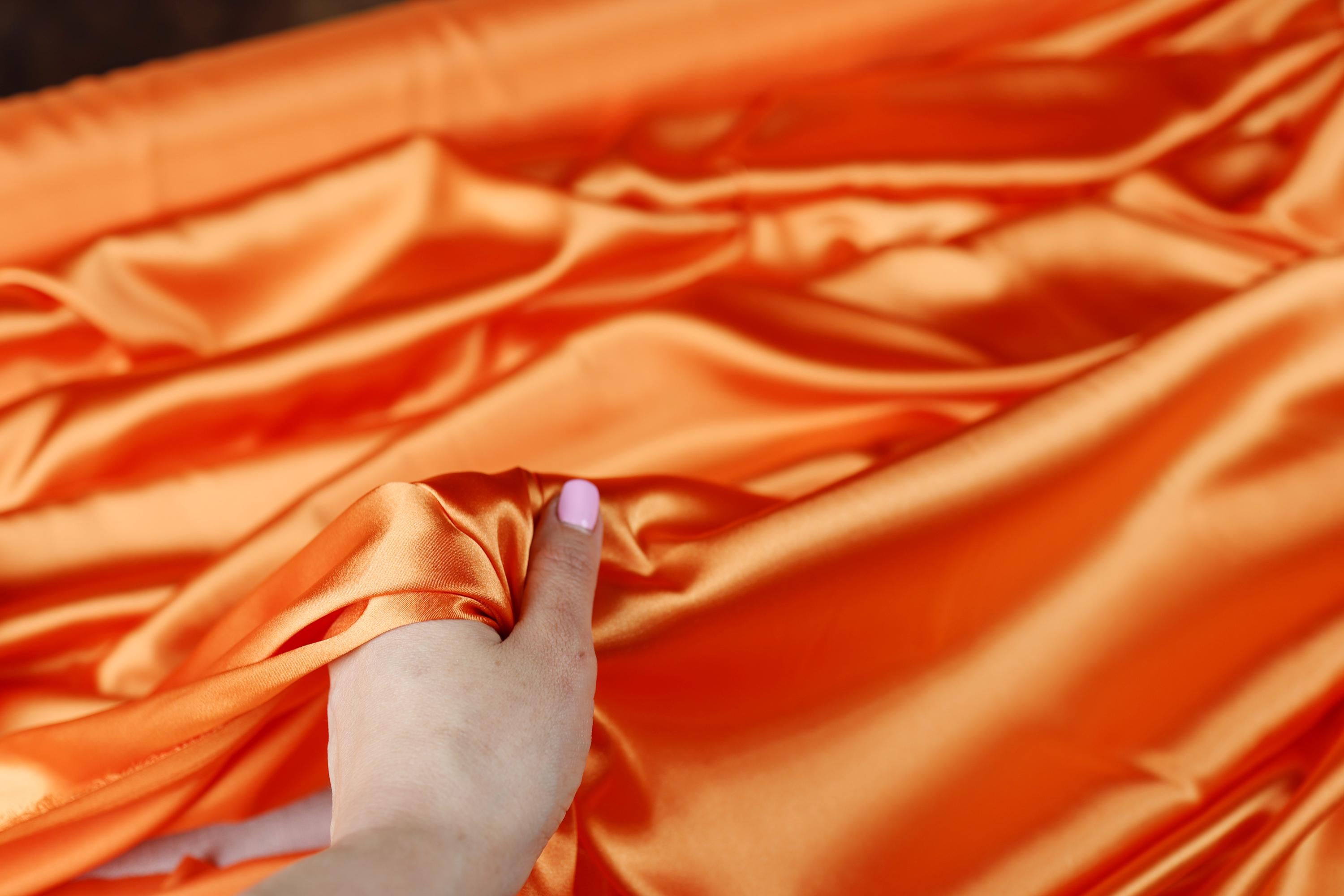 a person holding a piece of cloth in their hand