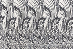 a repeating pattern of black and white floral designs on a fabric surface.