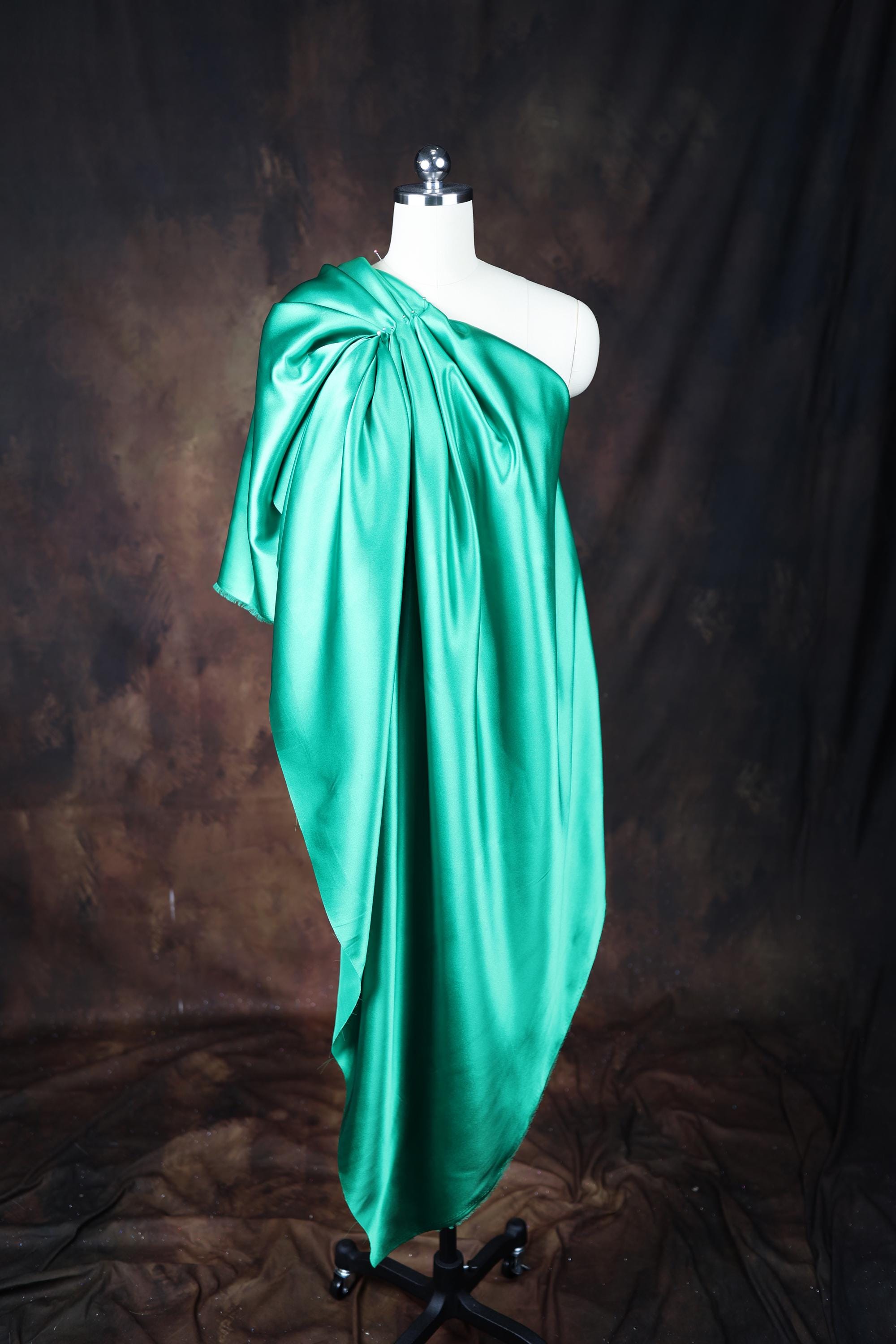 a dress on a mannequin on a black background