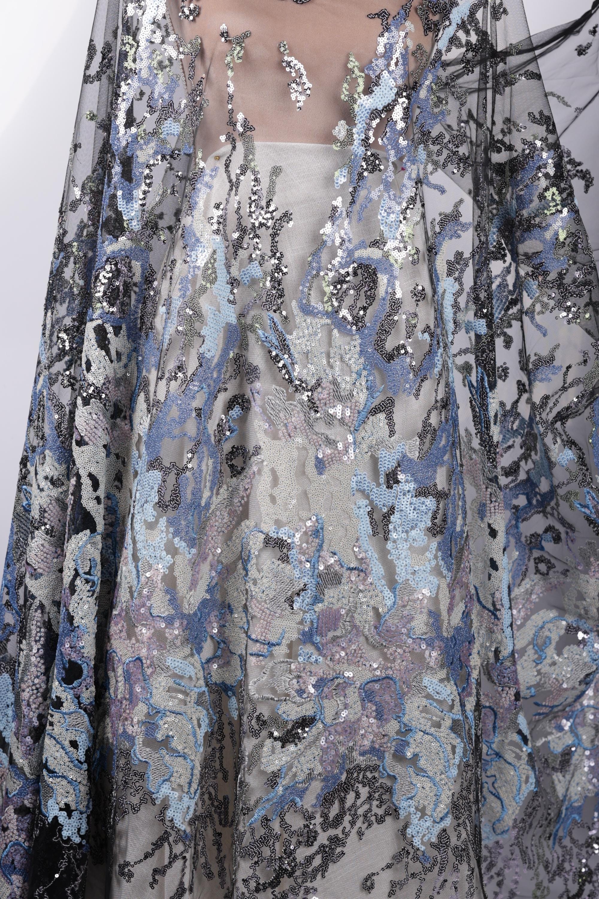 a close-up view of a fabric with a floral pattern, showcasing intricate details and textures.