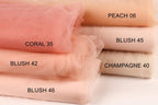 a collection of fabric swatches in various shades of peach, including coral, coral 35, coral 42, champagne 40, and champagne 46.