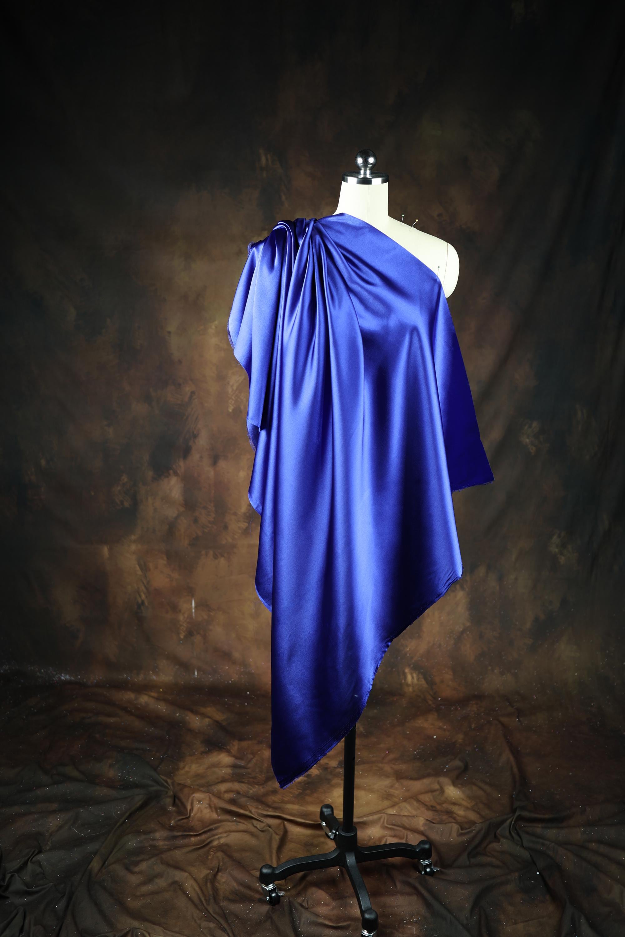 a mannequin dressed in a blue cape