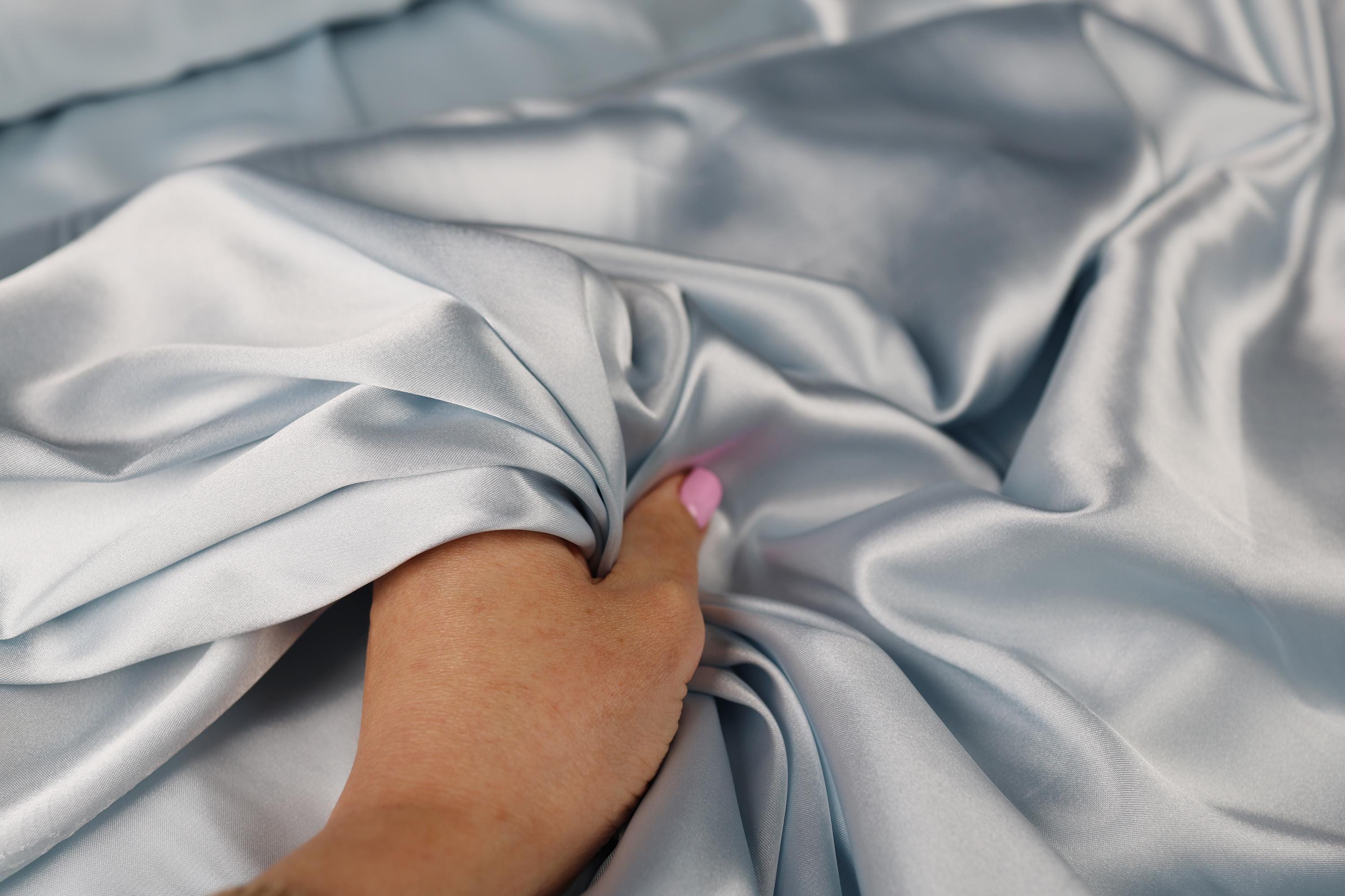 a person with a pink toothbrush in their hand