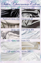 a collection of various satin fabrics in different colors, including black, dark gray, charcoal, silver, light blue, ivory, and off-white.