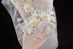 a close up of a person wearing a veil with flowers on it