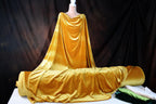 a mannequin dressed in a golden cloth