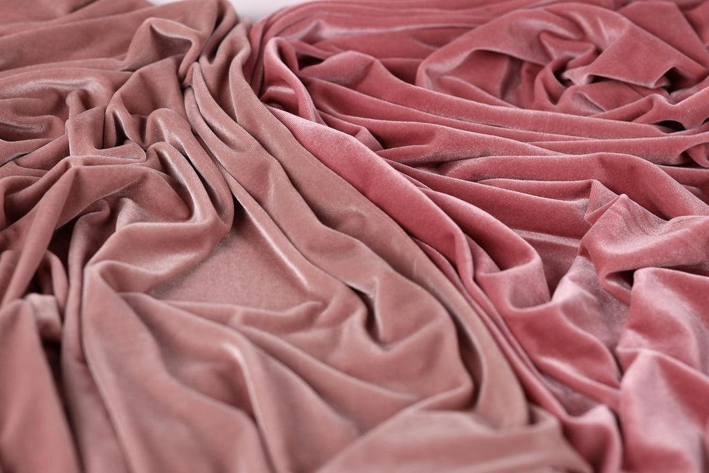 a close-up view of a crumpled, pink velvet fabric.