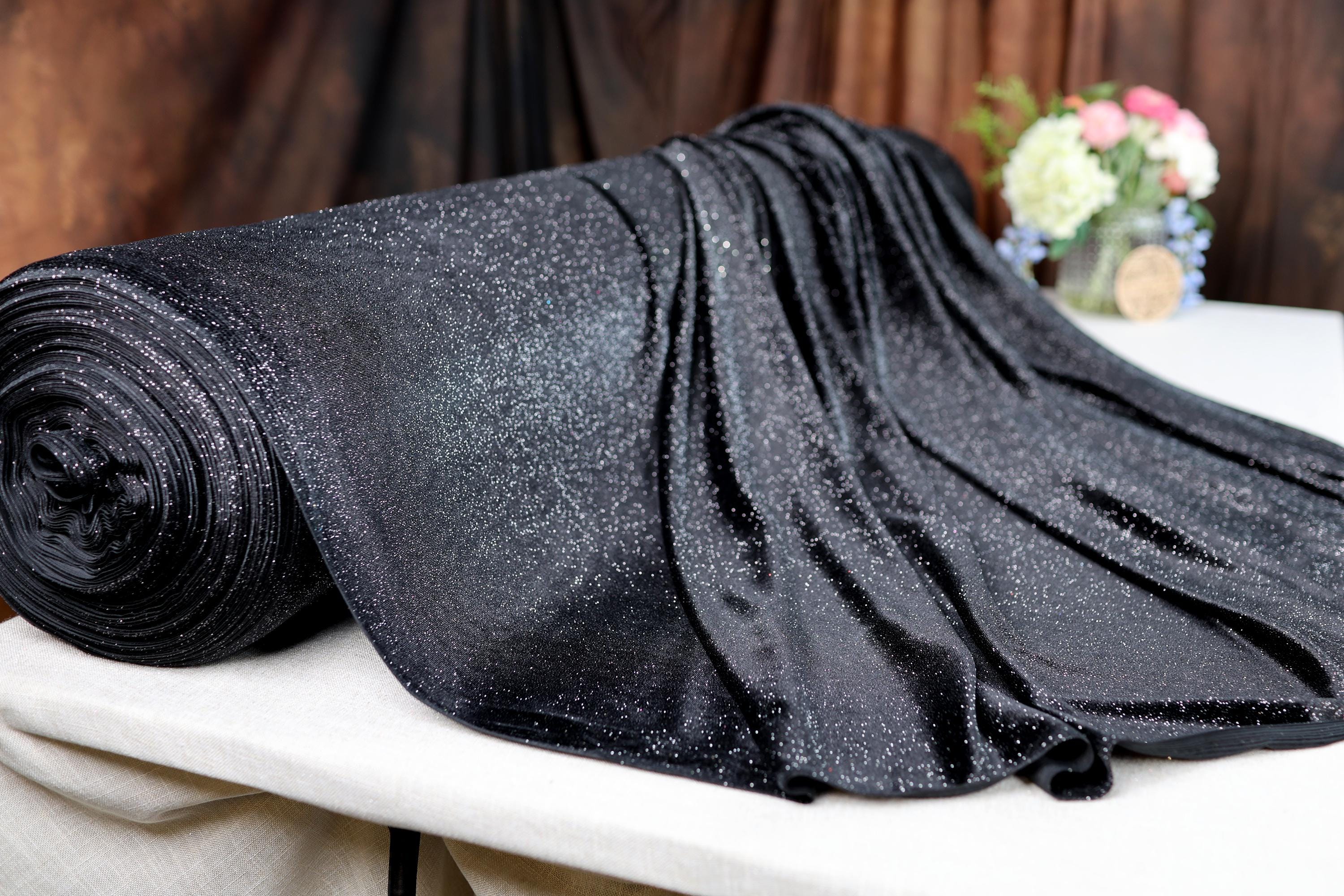 a close up of a black tie on a table