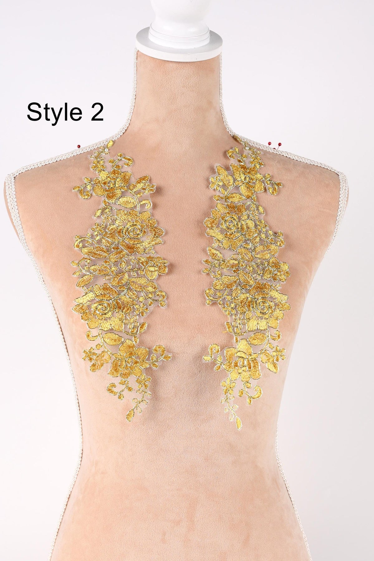 A mannequin with a gold-colored floral embroidered patch on the bust area, labeled as "Style 2".