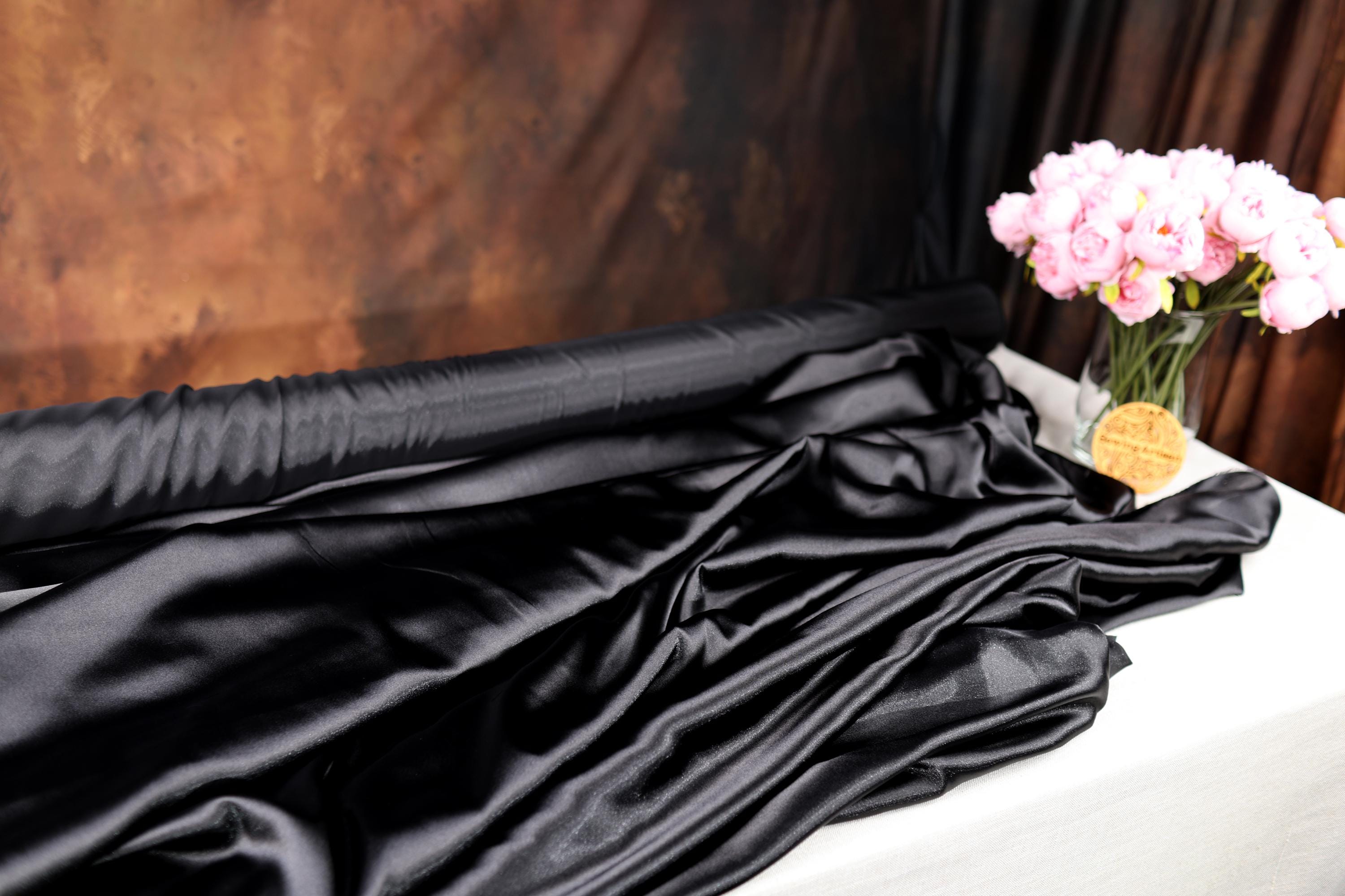 a vase filled with pink flowers sitting on top of a table