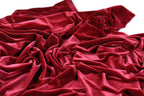 a close-up view of a crumpled, red velvet fabric.