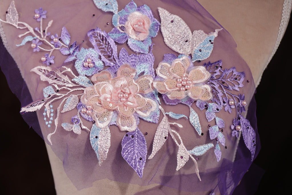a purple dress with flowers and butterflies on it