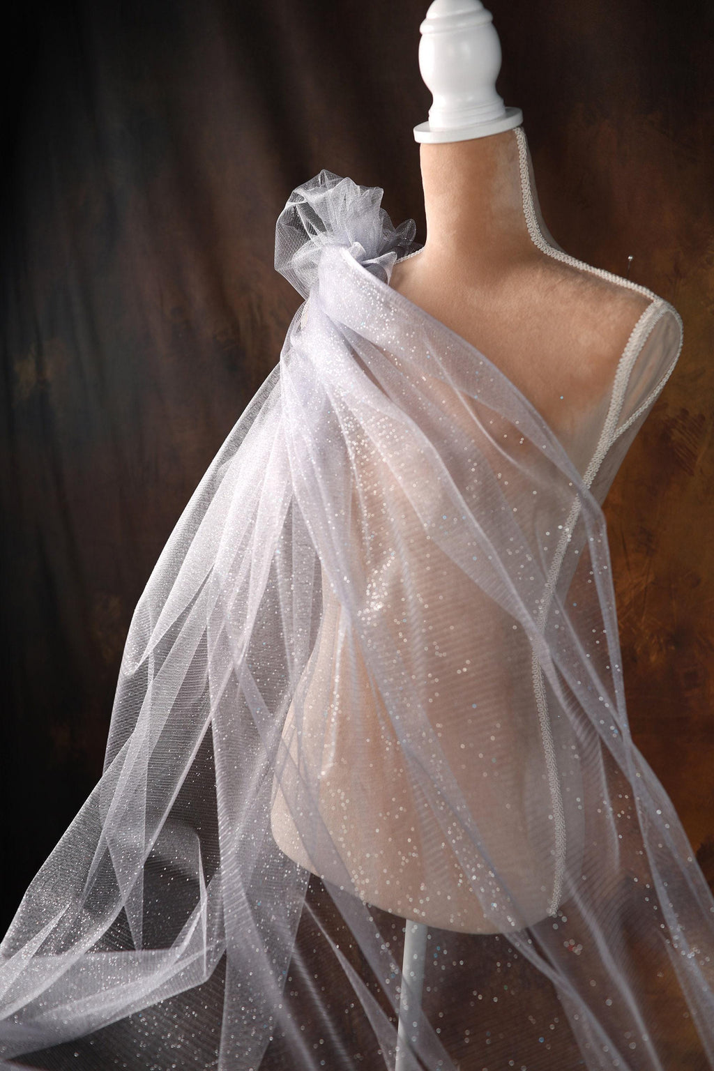 a mannequin with a veil on it's head