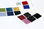 a collection of fabric swatches with various colors and patterns, including glittery, solid, and solid colors.