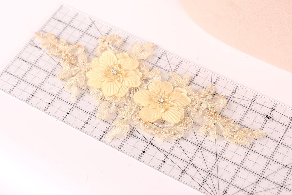 a clear ruler with a decorative floral design on it.