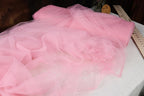 a piece of pink tulle sitting on top of a table