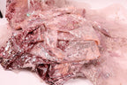 a close-up view of a fabric with pink and white sequin and lace patterns, creating a visually appealing and intricate design.