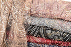 a collection of colorful, sequined fabric pieces stacked on top of each other.
