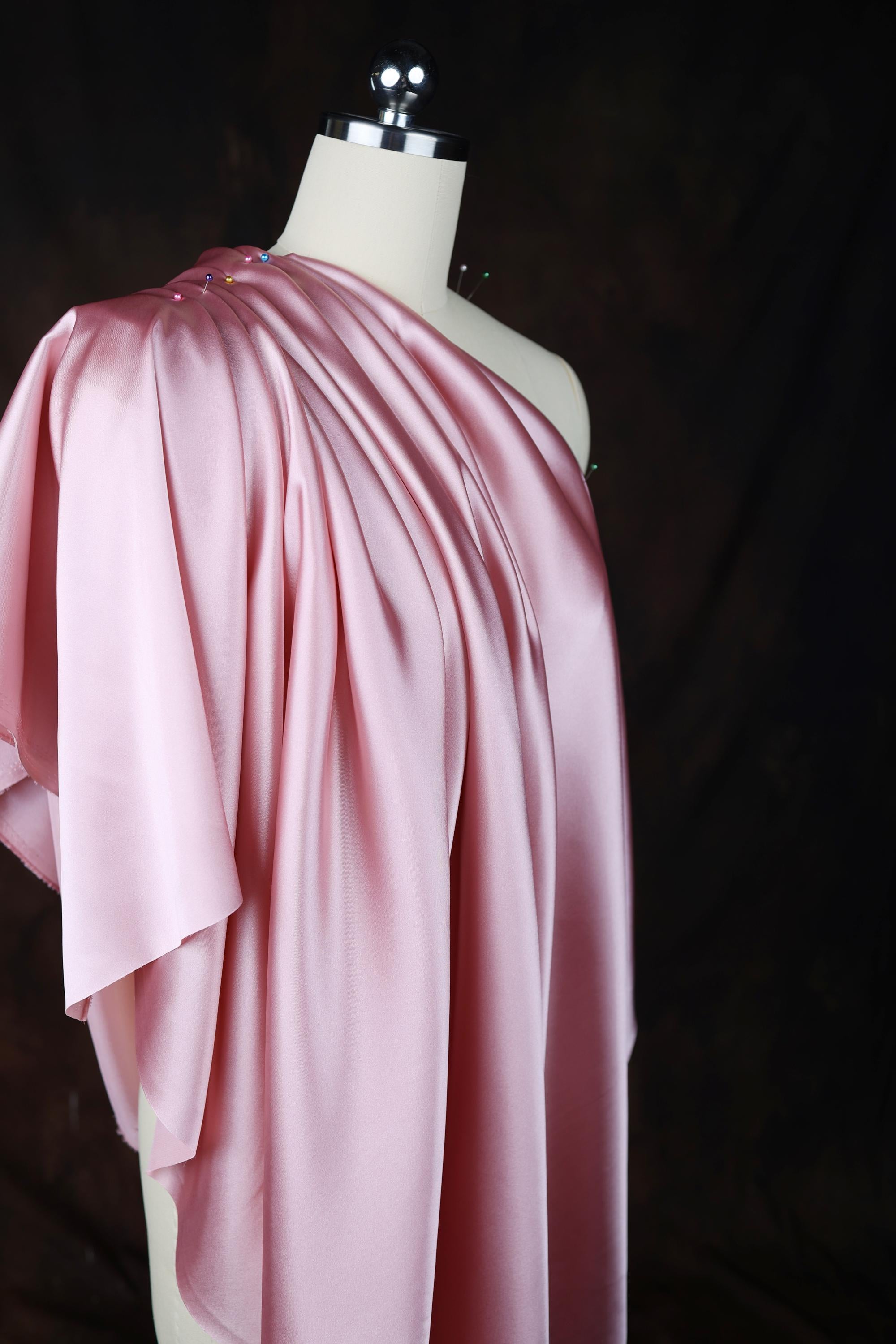 a dress on a mannequin on a black background