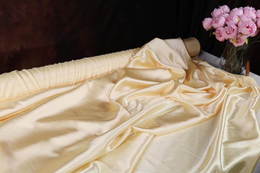 a vase filled with pink flowers sitting on top of a table