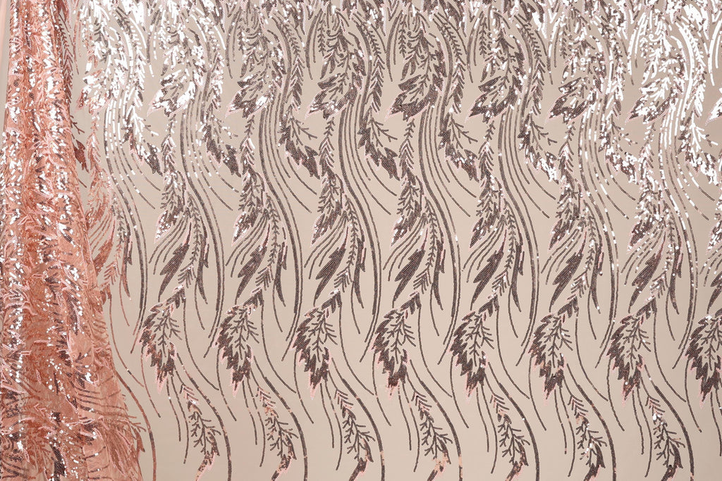 a close-up view of a fabric with a repeating pattern of leaves and flowers in shades of brown and beige. The pattern is intricate and detailed, creating a visually appealing and textured appearance.