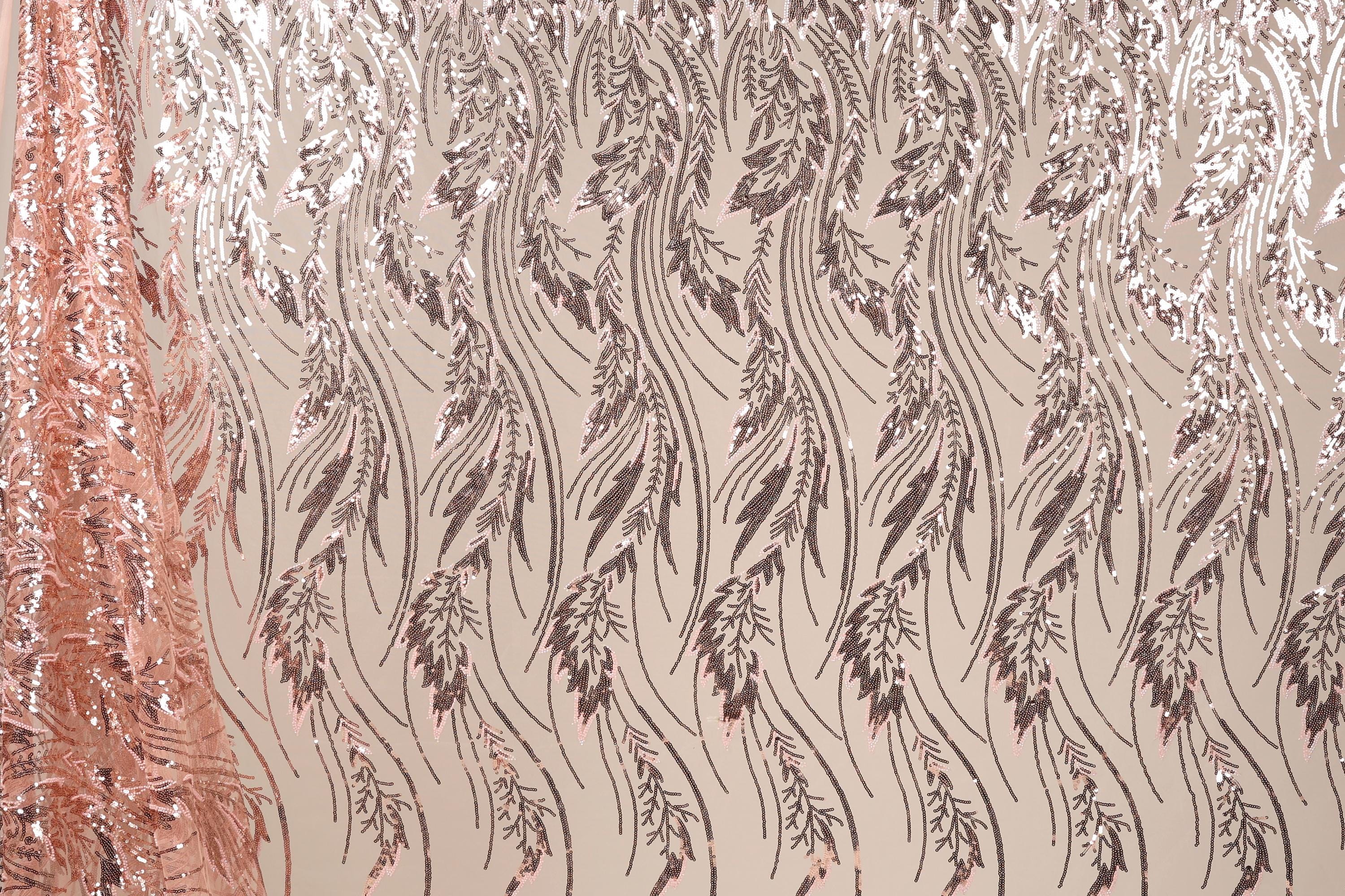 a close-up view of a fabric with a repeating pattern of leaves and flowers in shades of brown and beige. The pattern is intricate and detailed, creating a visually appealing and textured appearance.