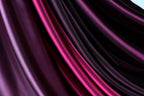 a close-up view of a fabric with a mix of purple and pink hues, creating a visually striking and vibrant pattern.