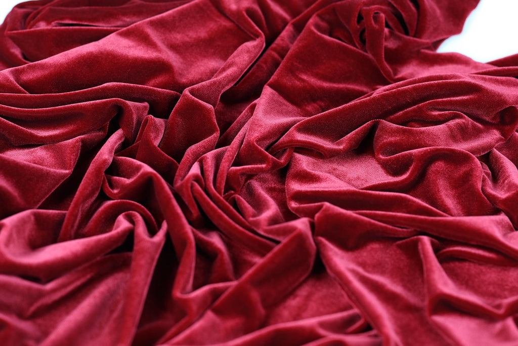 a close-up view of a crumpled, red velvet fabric.
