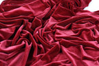 a close-up view of a crumpled, red velvet fabric.