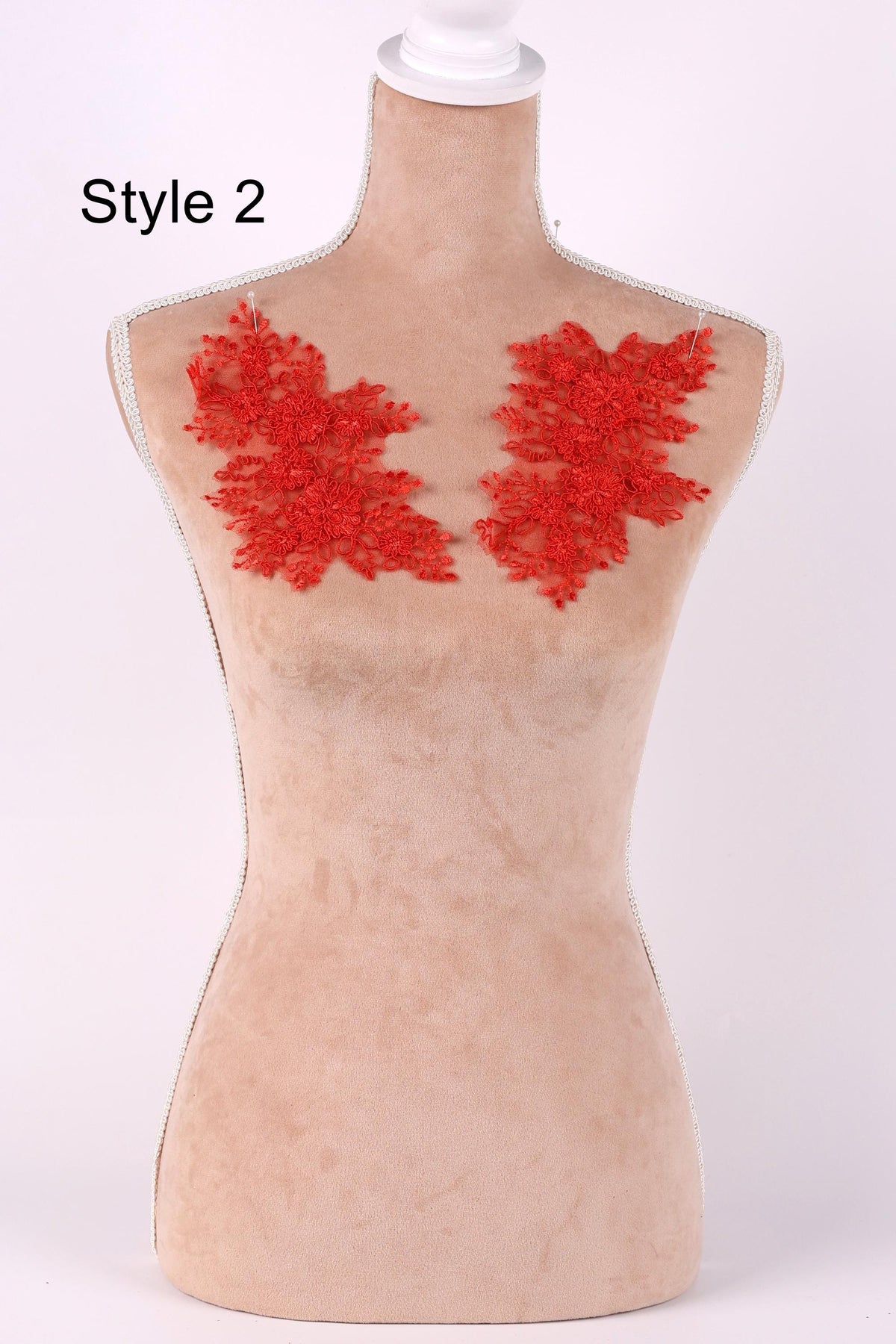 A mannequin with red floral embroidery on its bust area, labeled as "Style 2".