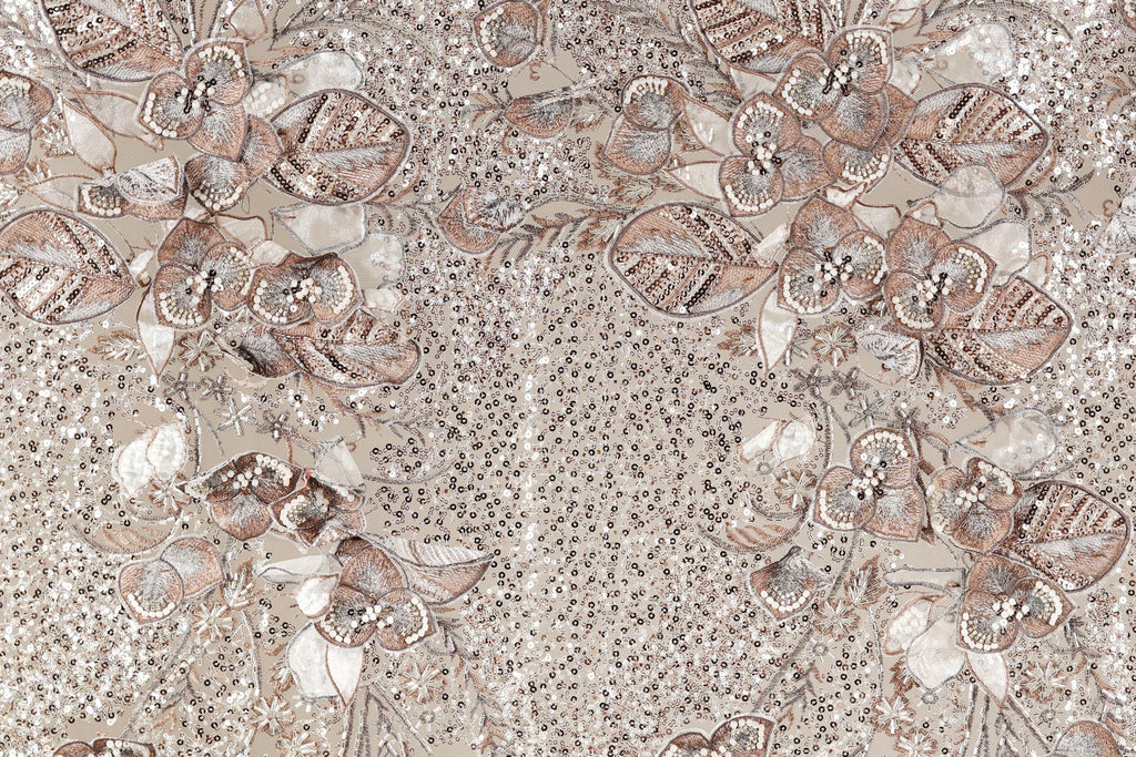 a detailed and intricate floral pattern with various shades of brown and beige, accented by small white dots. The pattern appears to be a collage of multiple images, creating a visually striking and textured composition.