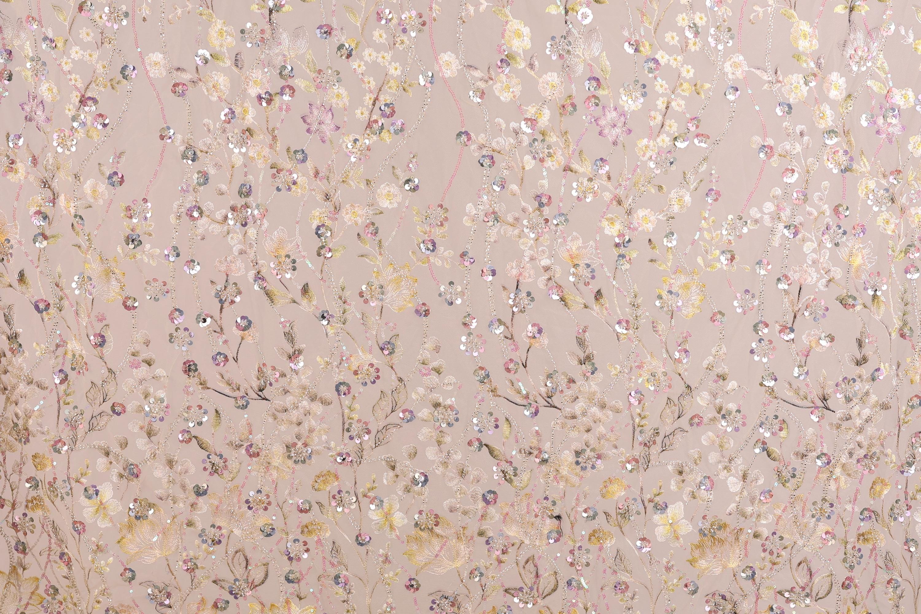 a pattern of pink and white flowers and leaves, with some areas of the flowers appearing to be sequined or embellished.