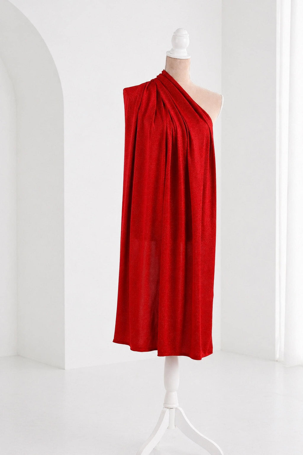 A red one-shoulder dress displayed on a mannequin against a white background.