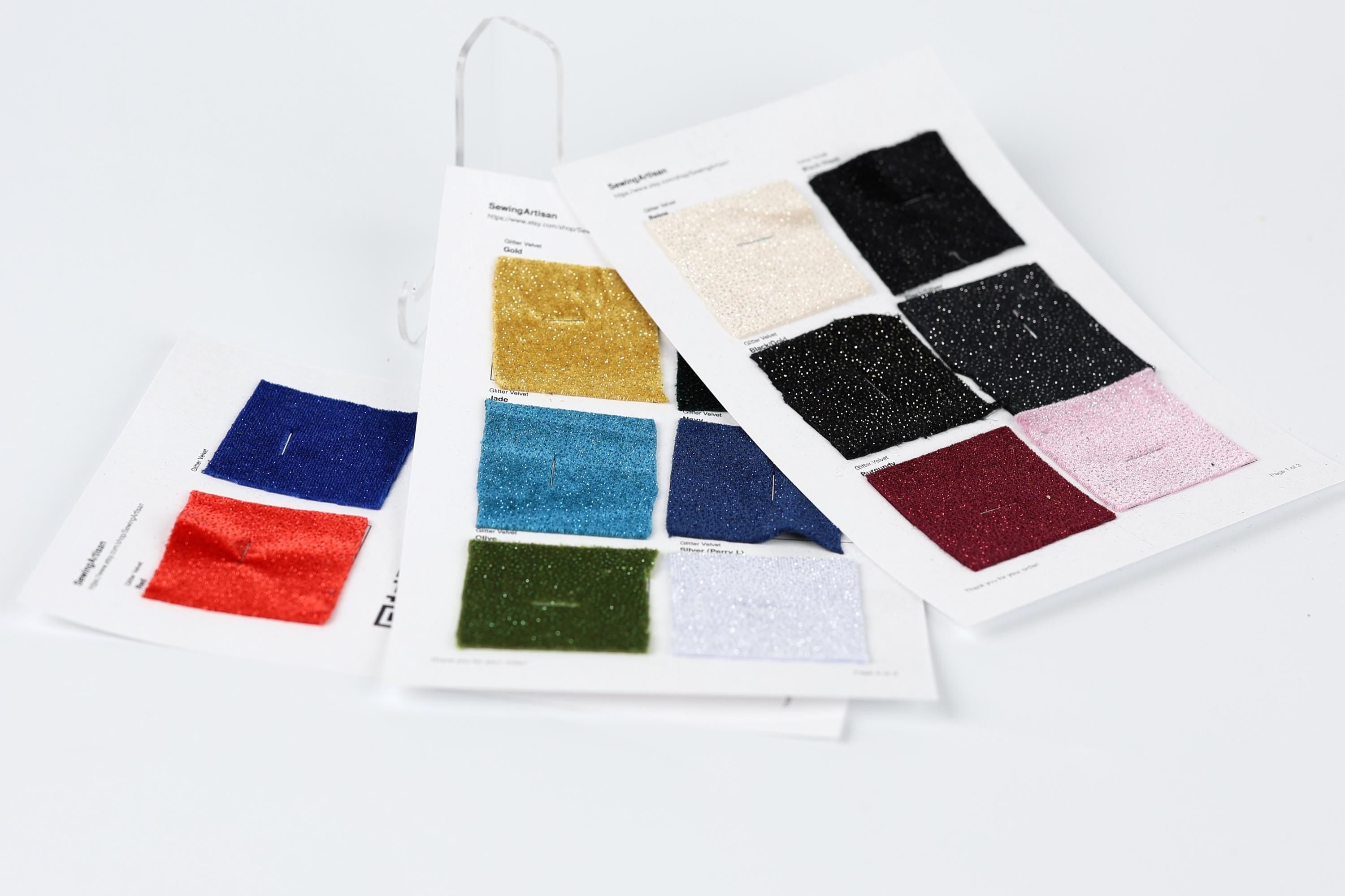 a collection of fabric swatches, each showcasing a different color and pattern, arranged on a white background.