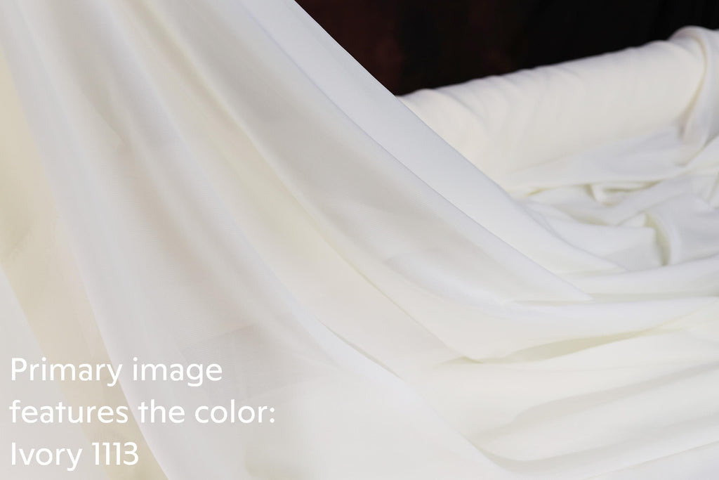 A close-up view of a white fabric, possibly a sheer or sheer-like material, with a text overlay that reads &quot;Primarily image features the color: Ivory 113&quot;.