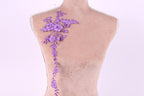 a mannequin with a floral embroidered on its back.