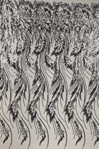 a repeating pattern of black and white feathers or leaves, creating a visually striking and intricate design.