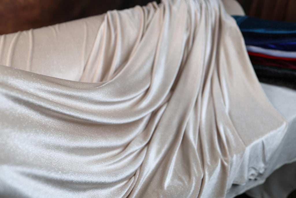 a close up of a bed with a sheet on it