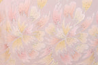 a repeating pattern of pink and yellow flowers with glittering details, creating a visually striking and vibrant design.