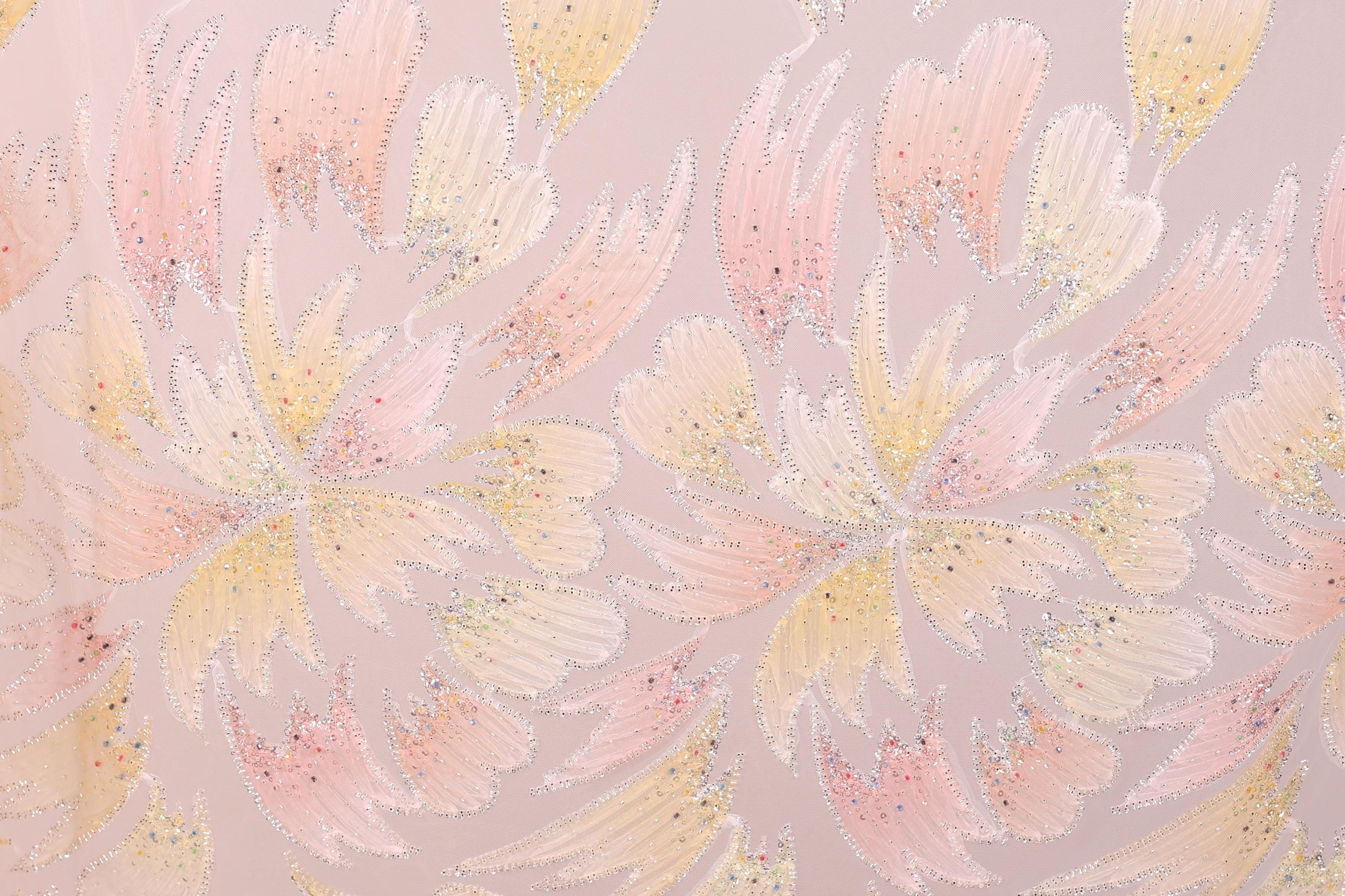 a repeating pattern of pink and yellow flowers with glittering details, creating a visually striking and vibrant design.