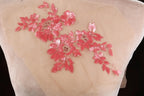 a piece of paper with pink sequins on it